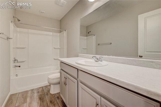 full bathroom with bathtub / shower combination, vanity, toilet, and hardwood / wood-style floors