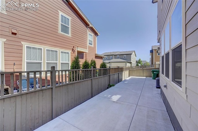 view of side of home with a patio