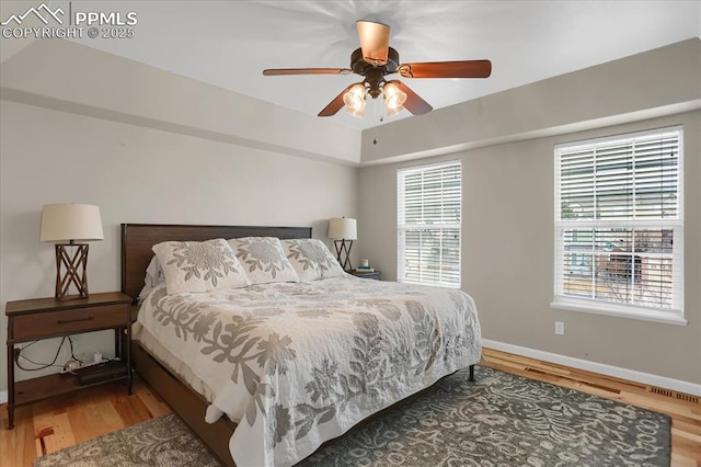 bedroom featuring hardwood / wood-style floors and ceiling fan