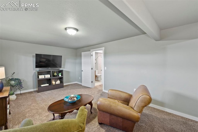 living room with carpet flooring, beamed ceiling, and baseboards