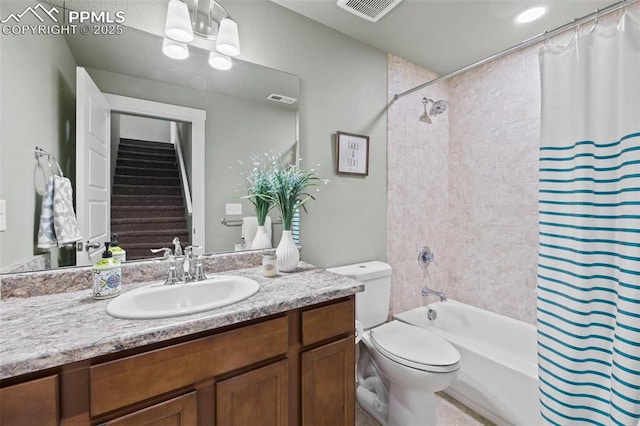 full bath featuring toilet, shower / tub combo, visible vents, and vanity