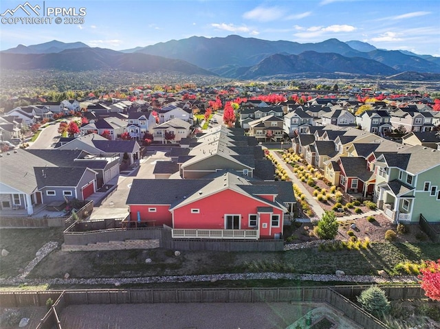 birds eye view of property featuring a mountain view and a residential view