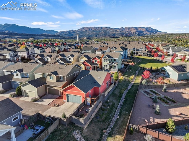 drone / aerial view with a residential view and a mountain view