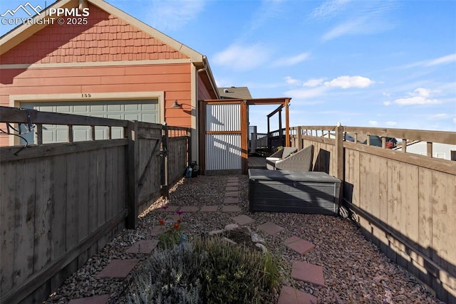 view of property exterior featuring fence and a deck