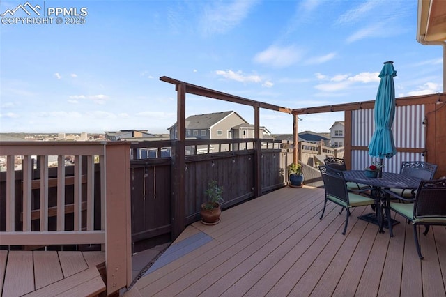 deck with outdoor dining area