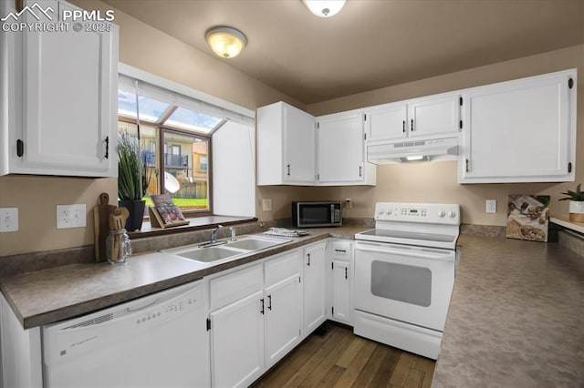 kitchen with white cabinetry, sink, white appliances, and dark hardwood / wood-style flooring