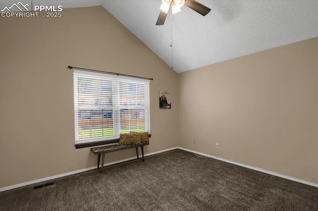 carpeted empty room featuring lofted ceiling and ceiling fan