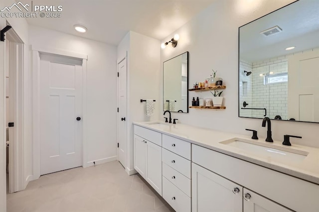 bathroom featuring an enclosed shower and vanity