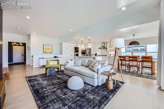 living room with light hardwood / wood-style flooring