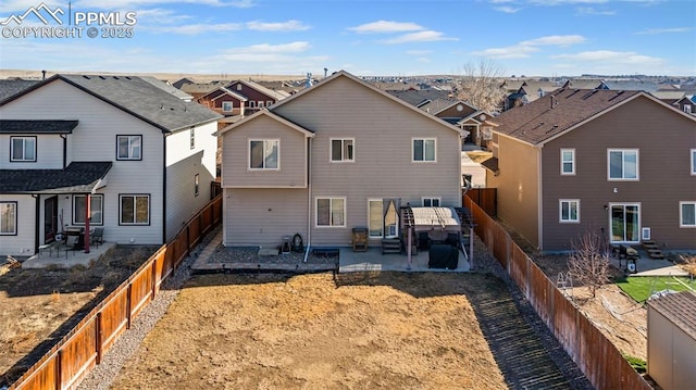 rear view of property with a patio area