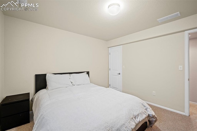 bedroom featuring light carpet