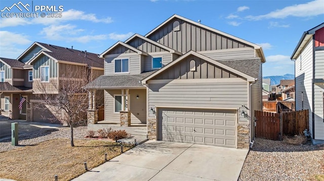 craftsman inspired home featuring a garage and a mountain view