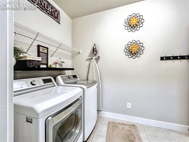 laundry room featuring light tile patterned flooring and independent washer and dryer