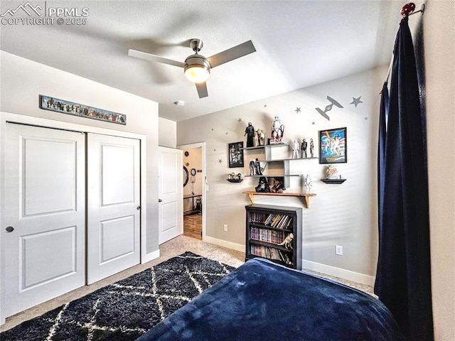 bedroom featuring light carpet, a closet, and ceiling fan