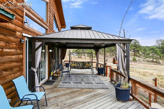 wooden deck featuring a gazebo