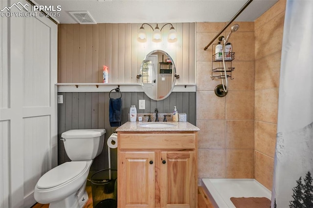 bathroom featuring vanity, toilet, and a shower with shower curtain