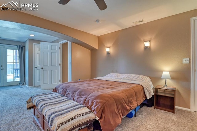 carpeted bedroom with french doors and ceiling fan