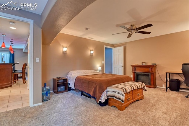 bedroom featuring light carpet and ceiling fan