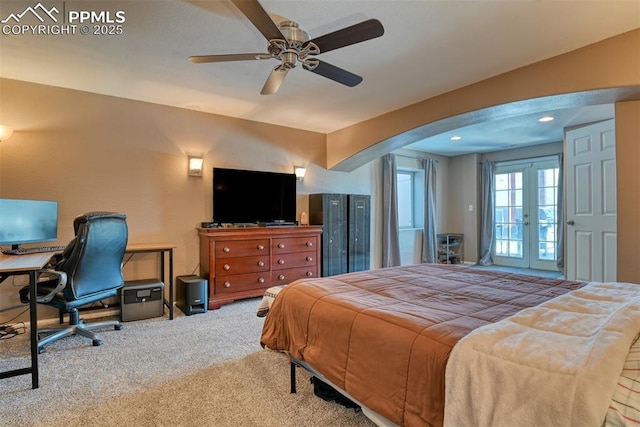 carpeted bedroom with french doors and ceiling fan