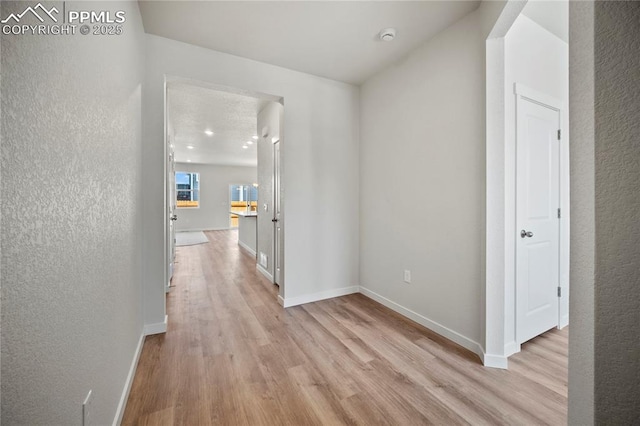 hallway featuring light hardwood / wood-style flooring