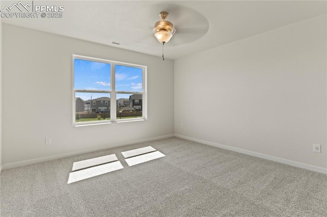 carpeted empty room featuring ceiling fan