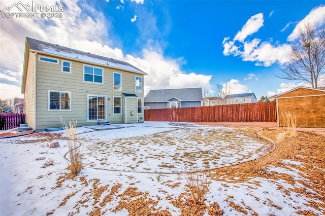 view of snow covered property