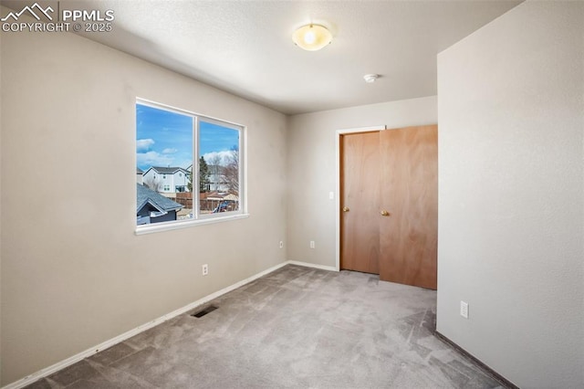 unfurnished bedroom featuring carpet