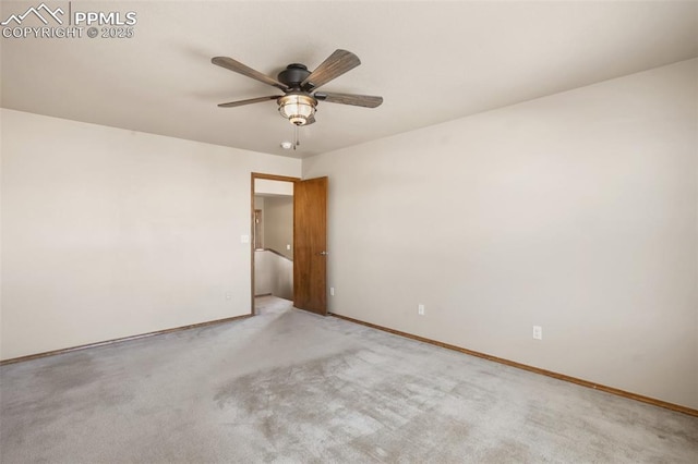 unfurnished room with ceiling fan and light colored carpet