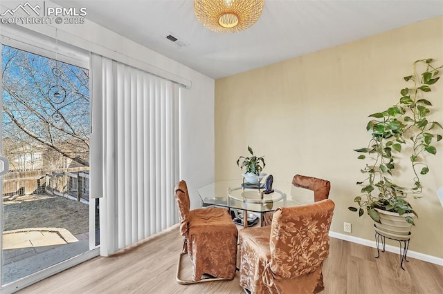 dining area with light wood-type flooring