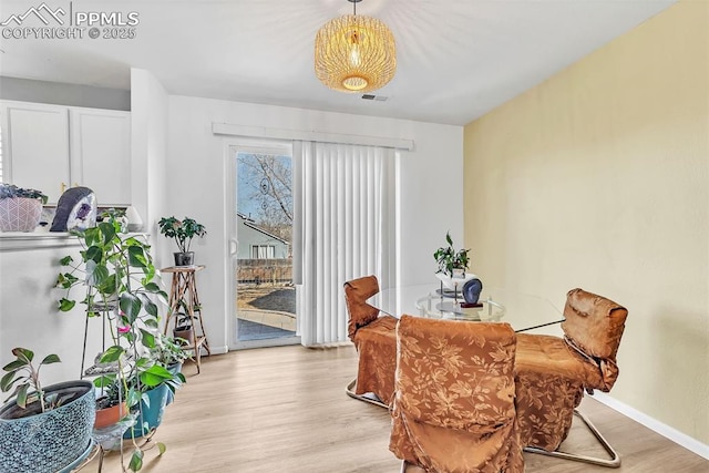 dining space featuring light hardwood / wood-style floors