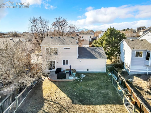 back of property featuring a lawn and a patio