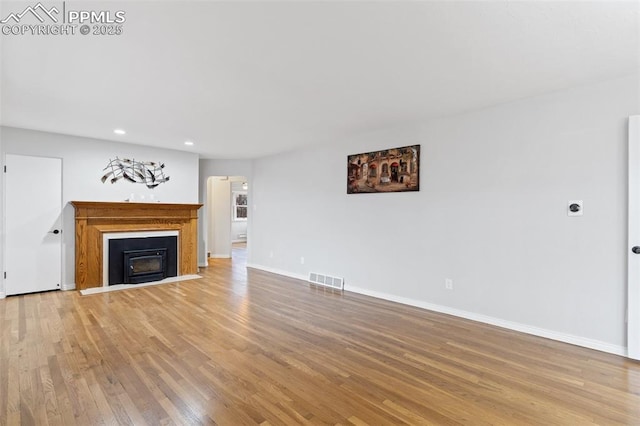 unfurnished living room featuring light hardwood / wood-style floors