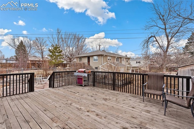 deck featuring a grill