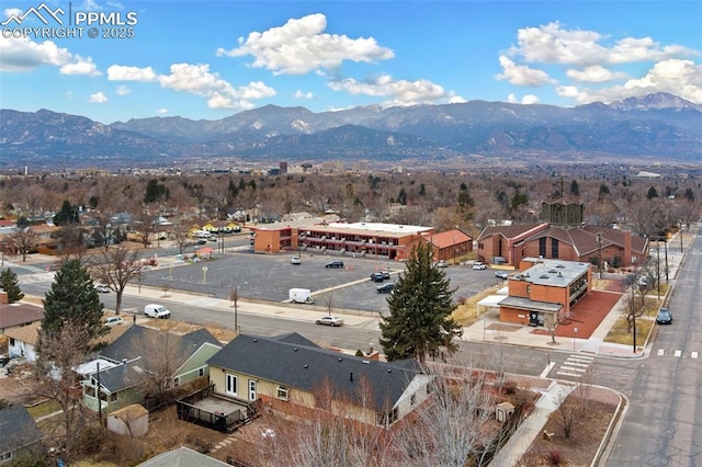 birds eye view of property featuring a mountain view