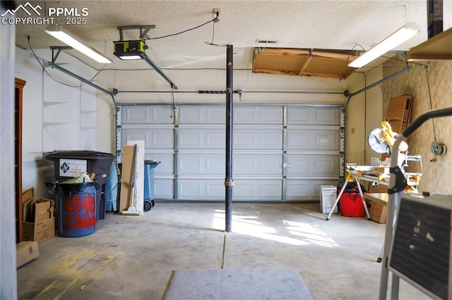 garage featuring a garage door opener