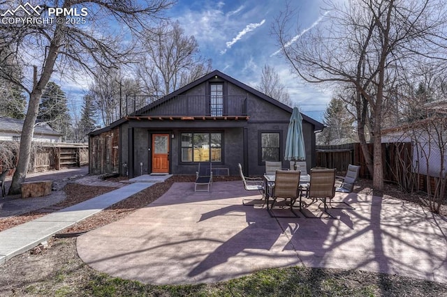 back of property with a patio area and a fenced backyard