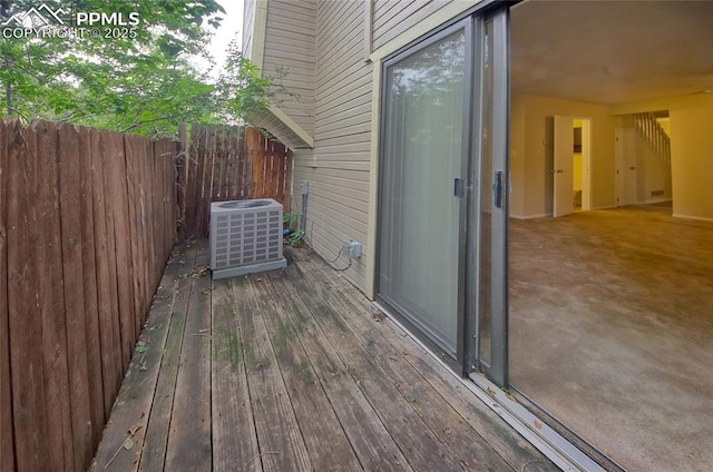 wooden terrace featuring central air condition unit