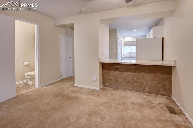 interior space featuring a textured ceiling