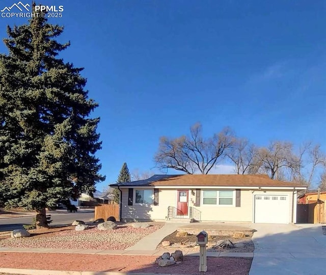 single story home with a garage