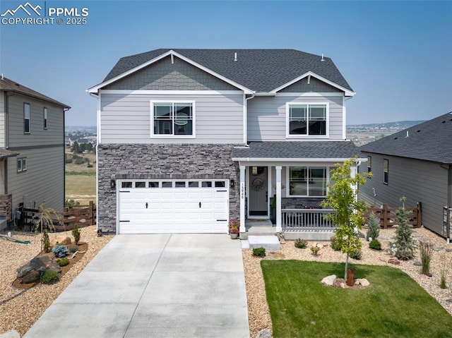 craftsman-style house featuring a porch, a garage, and a front yard