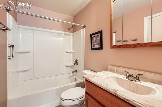 full bathroom featuring vanity, bathtub / shower combination, and toilet