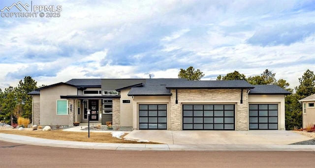 prairie-style house featuring a garage