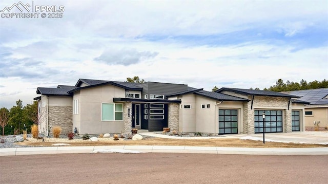 prairie-style house featuring a garage