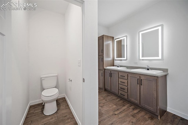 20 Apache Cir, Florissant, CO 80816 - full bathroom featuring wood finished floors, baseboards, and a sink