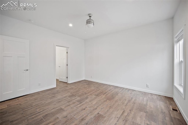 20 Apache Cir, Florissant, CO 80816 - spare room featuring a wealth of natural light, wood finished floors, visible vents, and baseboards