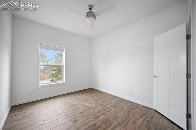 20 Apache Cir, Florissant, CO 80816 - spare room featuring wood finished floors, visible vents, a ceiling fan, and baseboards