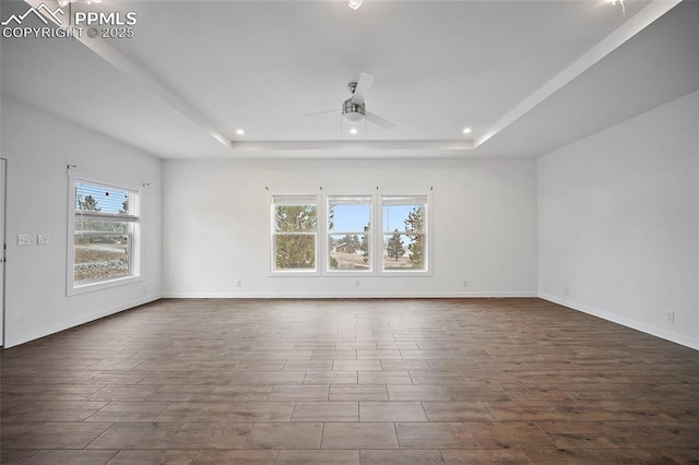 20 Apache Cir, Florissant, CO 80816 - empty room with recessed lighting, dark wood-style floors, a tray ceiling, a ceiling fan, and baseboards
