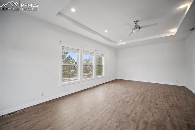 20 Apache Cir, Florissant, CO 80816 - empty room featuring recessed lighting, a raised ceiling, wood finished floors, visible vents, and a ceiling fan