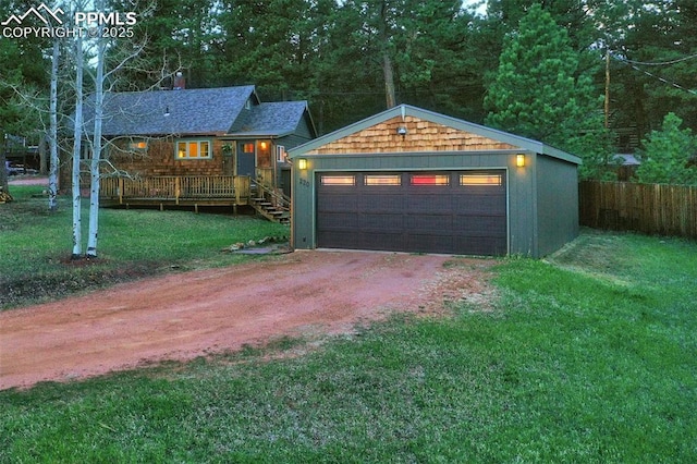 garage featuring a lawn