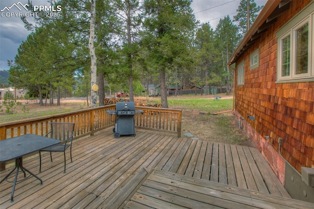 wooden deck featuring area for grilling